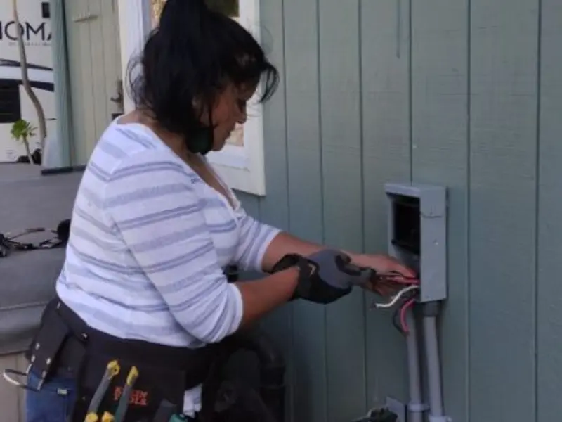 Licensed electrician wiring an exterior subpanel in Abingdon