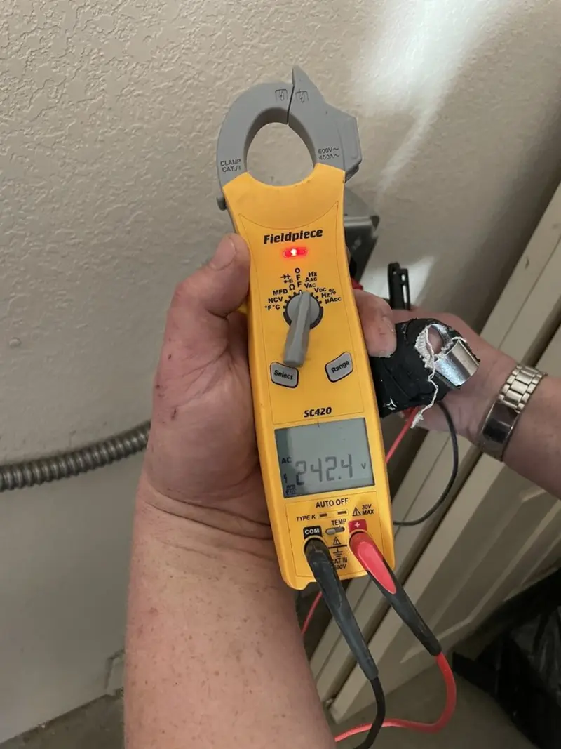 Voltage testing with clamp meter during Outlet Installation in Abingdon